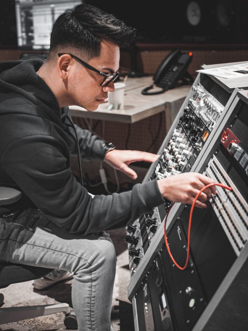 GK patching outboard gear during a recording session